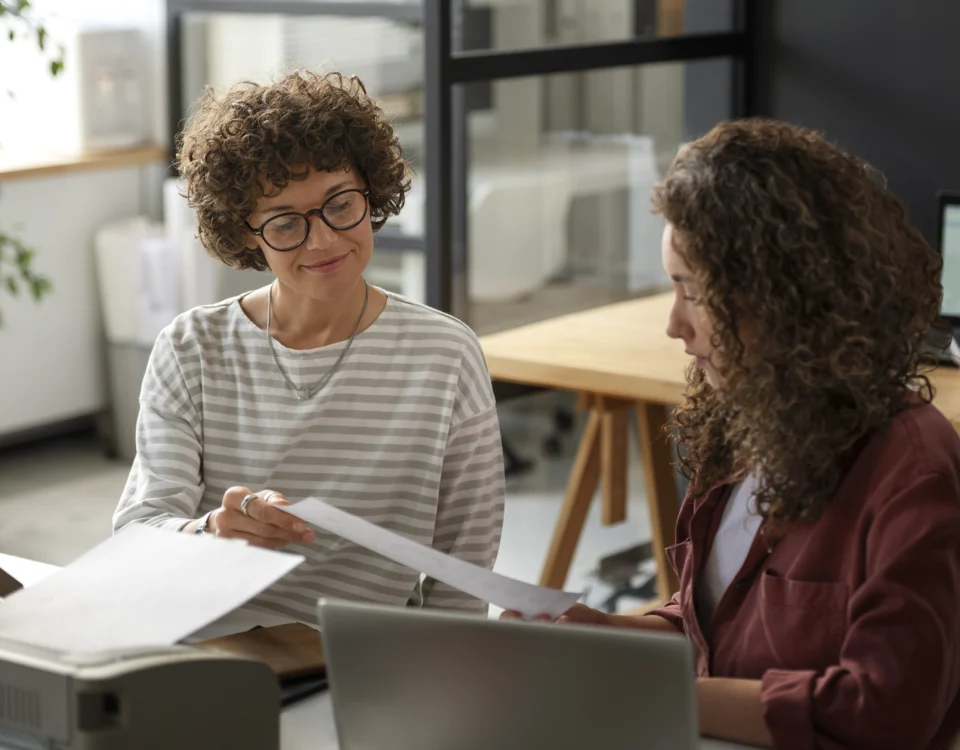 Professional lady mentoring younger colleague