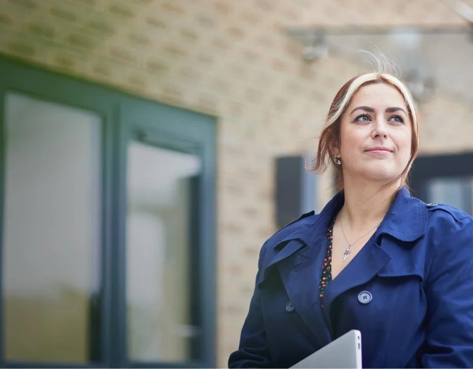 Young professional woman outside an office building